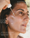 Close-up of a woman receiving a skincare dropper treatment, with overlaid text highlighting benefits such as collagen support, tension relief, and restored natural glow.
