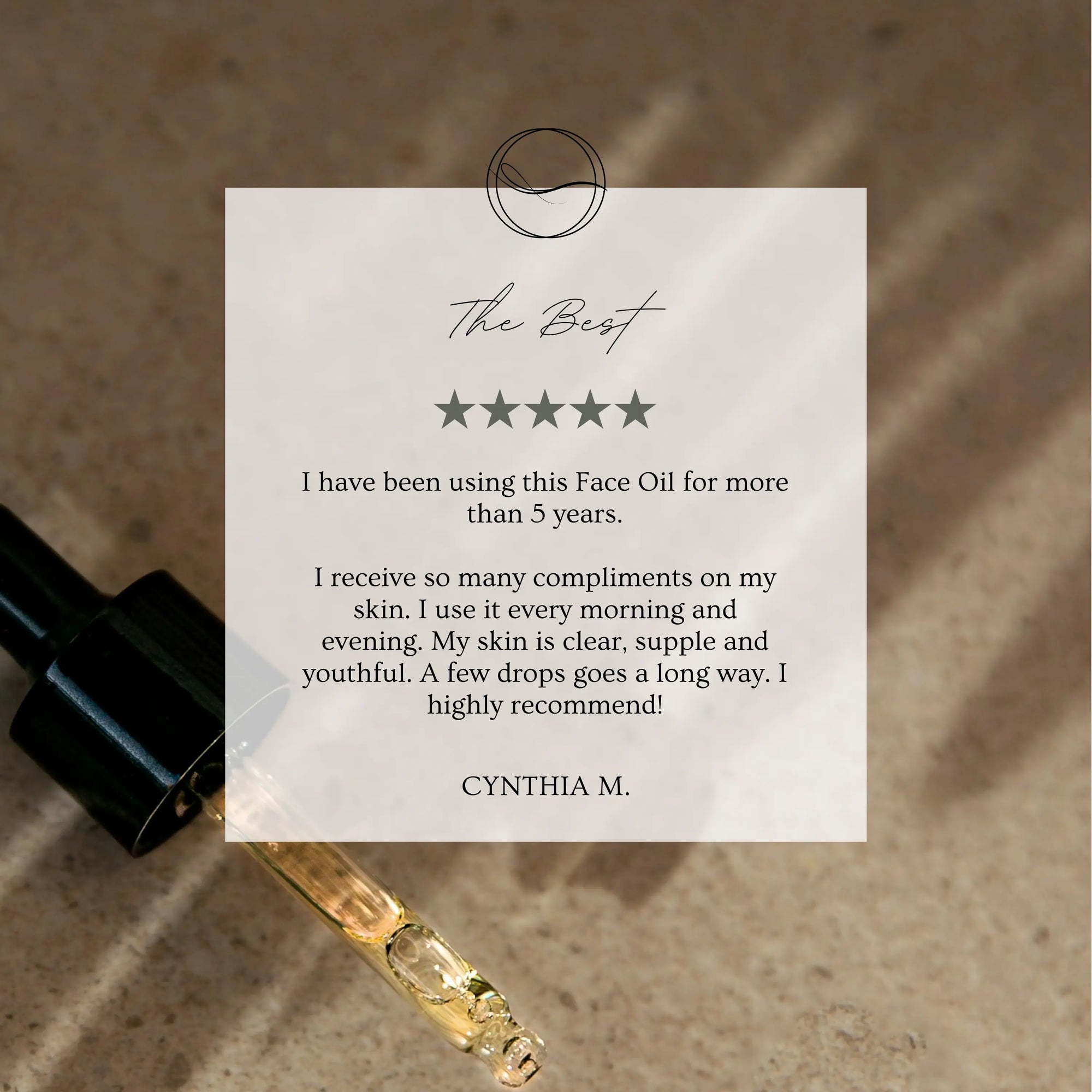 A promotional review card for a facial oil, styled over a close-up of a black dropper bottle and a glass dropper containing golden oil on a textured beige surface. The card reads 'The Best' with five stars and a testimonial signed Cynthia M.